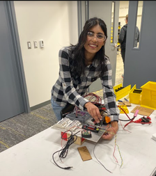 A robotics member shows her wiring project.